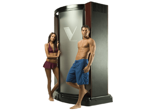 Man and woman posing with Versa Spa spray tan booth.